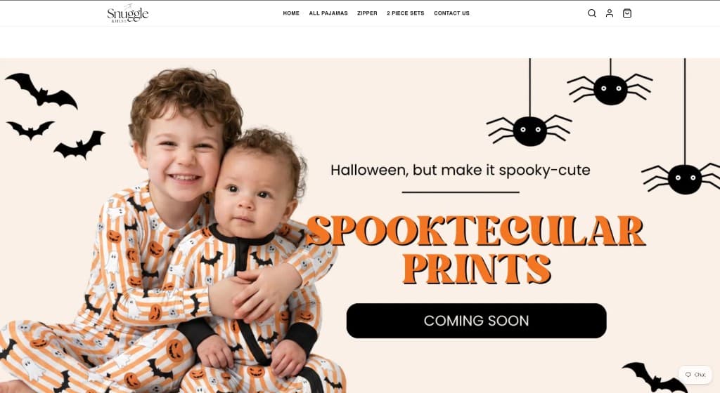 Snuggle & Hush Shopify homepage: Halloween kids pajamas hero with Spooktacular Prints headline.